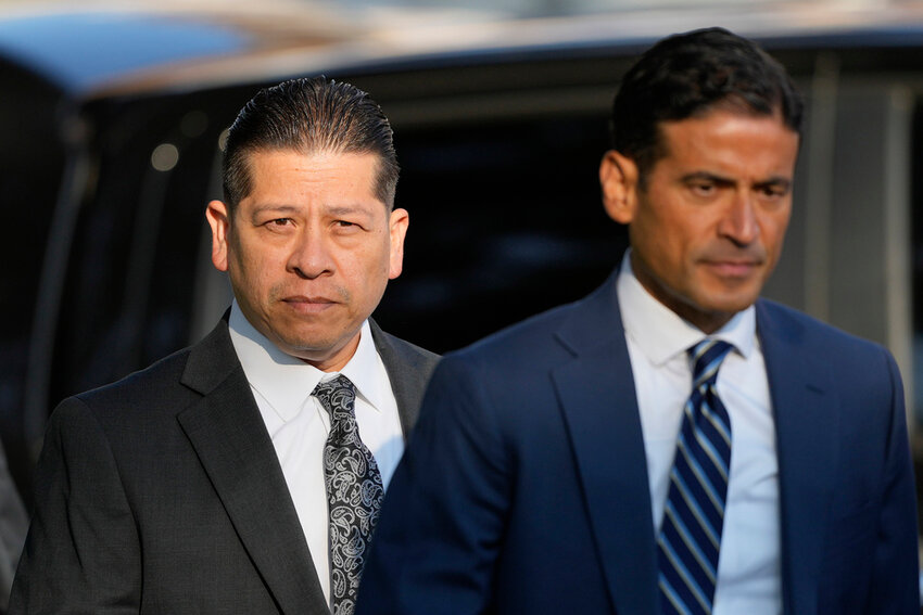 Former Uvalde Consolidated Independent School District police officer Adrian Gonzales, left, arrives at the Uvalde County Courthouse for a court appearance, Thursday, July 25, 2024, in Uvalde, Texas. (AP Photo/Eric Gay)