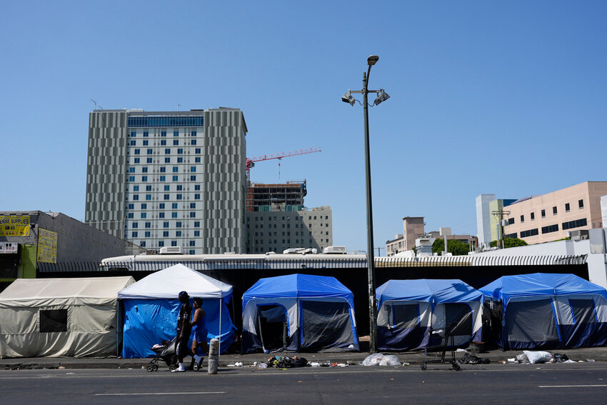 Tents are lined up on Skid Row Thursday, July 25, 2024, in Los Angeles. (AP Photo/Jae C. Hong)