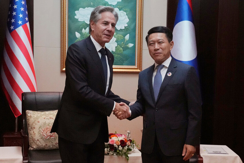 U.S. Secretary of State Antony Blinken, left, shakes hands with Laos Foreign Minister Saleumxay Kommasith during ASEAN Foreign Ministers Meeting (AMM) in Vientiane, Laos, Saturday, July 27, 2024. (AP Photo/Achmad Ibrahim, Pool)