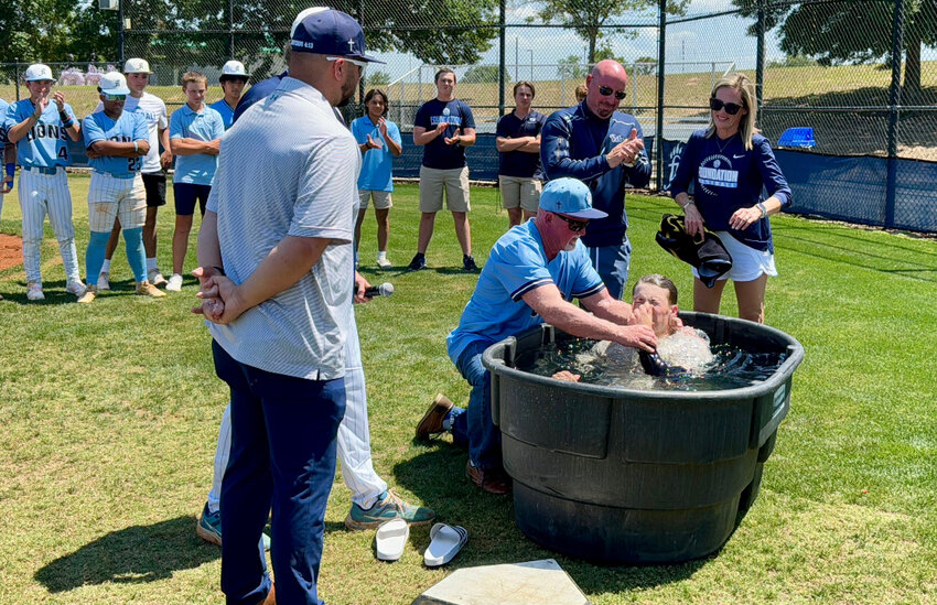 A Foundation Academy baseball player is baptized. (Photo/Florida Baptist Witness)