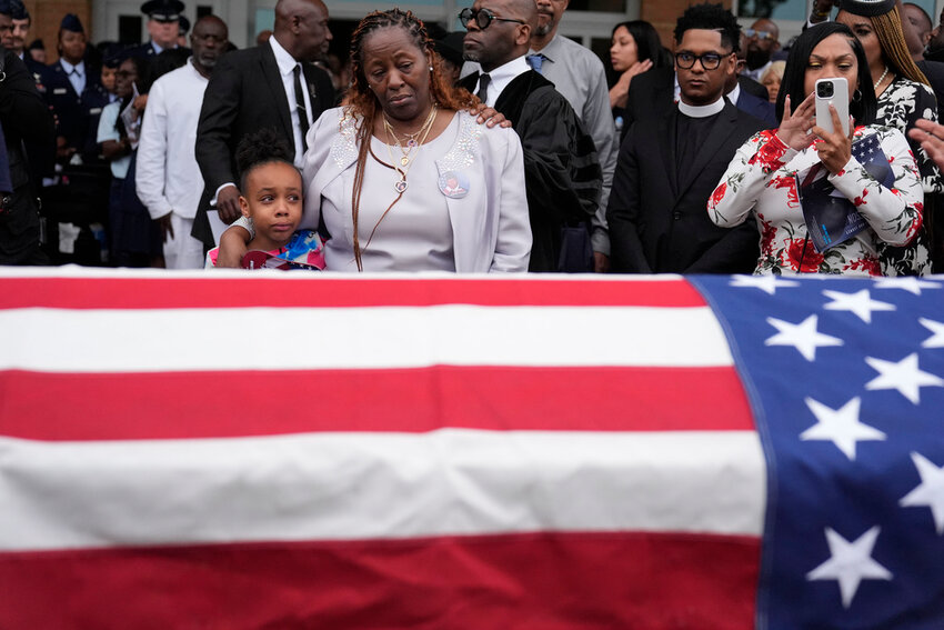 Chantemekki Fortson, the mother of slain airman Roger Fortson, right, along with family watch Fortson's casket as they leave for a cemetery during his funeral at New Birth Missionary Baptist Church, on May 17, 2024, in Stonecrest, Ga. (AP Photo/Brynn Anderson, File)