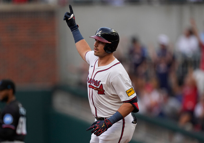 Atlanta Braves' Austin Riley gestures as he rounds the bases after hitting a solo-home run in the first inning against the Miami Marlins, Thursday, Aug. 1, 2024, in Atlanta. (AP Photo/John Bazemore)