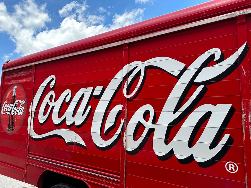 The Coca-Cola logo adorns the side of a delivery truck May 15, 2024, in southeast Denver. (AP Photo/David Zalubowski, File)
