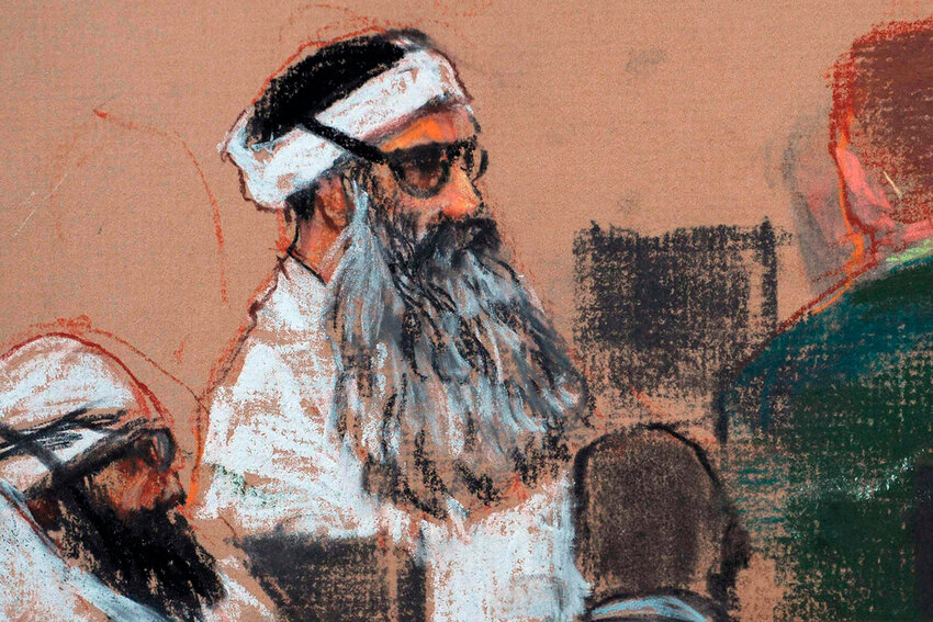 This courtroom drawing by artist Janet Hamlin shows Khalid Sheikh Mohammed, center, and co-defendant Walid Bin Attash, left, attending a pre-trial session at Guantanamo Bay Naval Base, Cuba, Dec. 8, 2008. (AP Photo/Janet Hamlin, Pool, File)