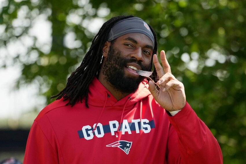 New England Patriots linebacker Matthew Judon walks onto the field during a joint practice with the Philadelphia Eagles, Tuesday, Aug. 13, 2024, in Foxborough, Mass. (AP Photo/Michael Dwyer)