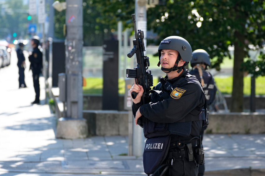 Police officers patrol near a scene after police shot and killed a gunman near the Israeli Consulate in Munich, Germany, Thursday, Sept. 5, 2024. (AP Photo/Matthias Schrader)