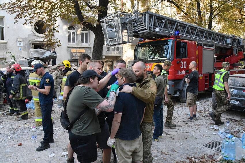 Medics give first aid to Yaroslav Bazylevych, who lost his family in a Russian missile attack in the western city of Lviv, Ukraine, Wednesday, Sept. 4, 2024. (AP Photo/Mykola Tys)