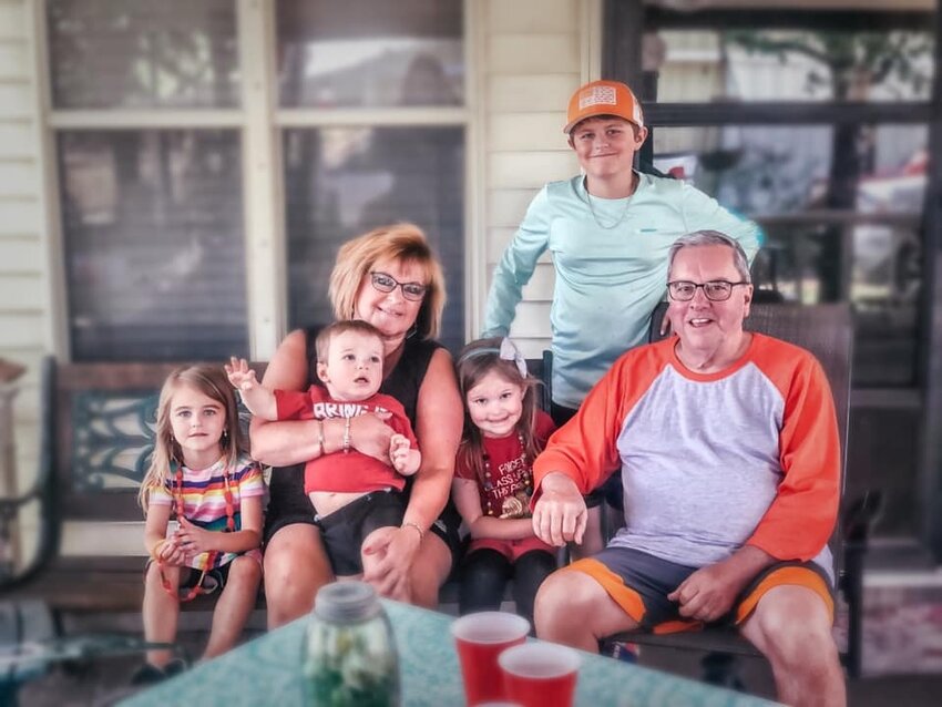 Bobby and Wanda Mullins, pictured here with their grandchildren in 2021, died from injuries sustained in a car crash Sept. 4. Bobby Mullins died on impact, and Wanda died the following day at the hospital. (Photo/The Baptist Paper from Facebook)