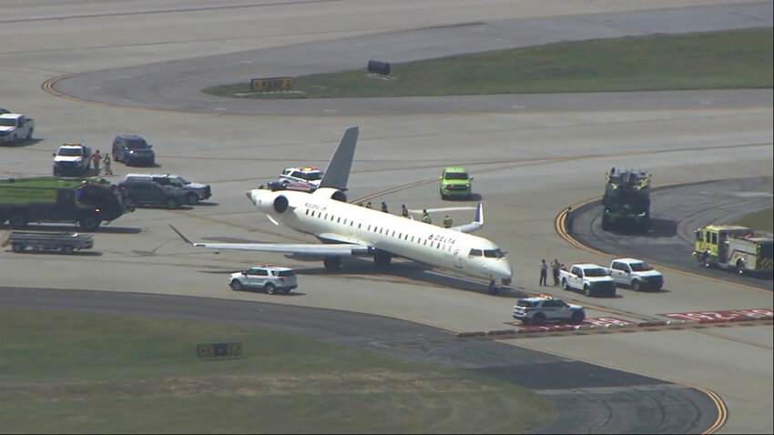 A damaged plane sits at Hartsfield-Jackson Atlanta International Airport after colliding with another plane on a taxiway, Tuesday, Sept. 10, 2024. (WSB via AP)