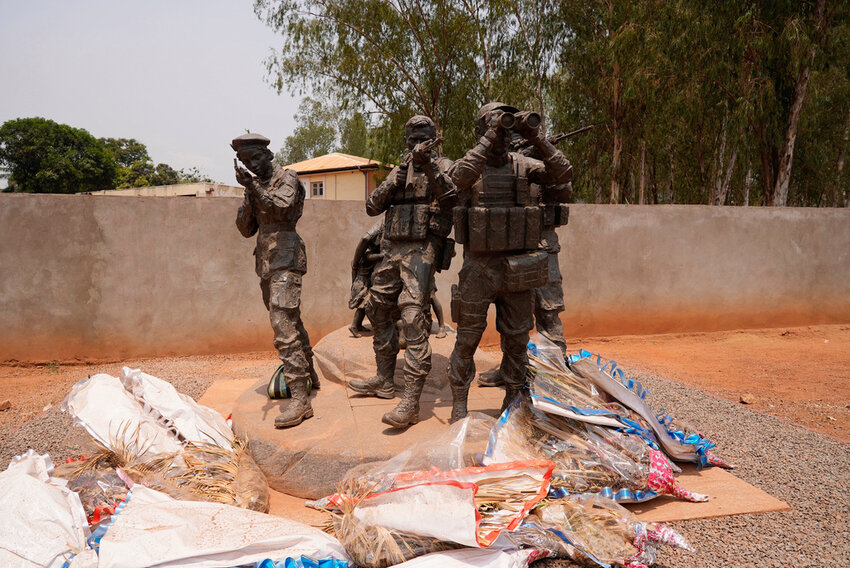 Flowers are laid at the statue of Russian mercenaries as a tribute to the late Wagner leader Yevgeny Prigozhin in Bangui, Central African Republic, on March. 5, 2024. (AP Photo/Sam Mednick, File)