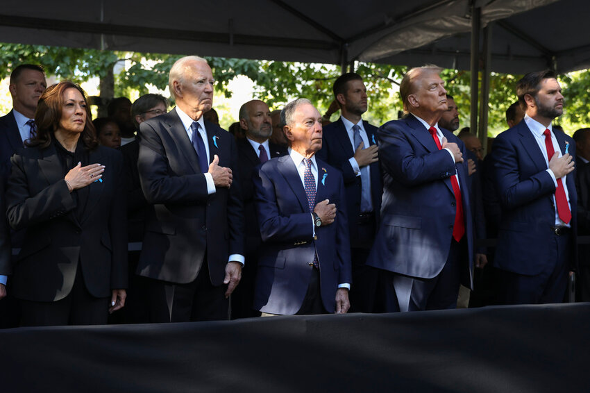 From left, Democratic presidential nominee Vice President Kamala Harris, President Joe Biden, Michael Bloomberg, Republican presidential nominee former President Donald Trump and Republican vice presidential nominee Sen. JD Vance, R-Ohio, attend the 9/11 Memorial ceremony on the 23rd anniversary of the Sept. 11, 2001 terror attacks, Wednesday, Sept. 11, 2024, in New York. (AP Photo/Yuki Iwamura)