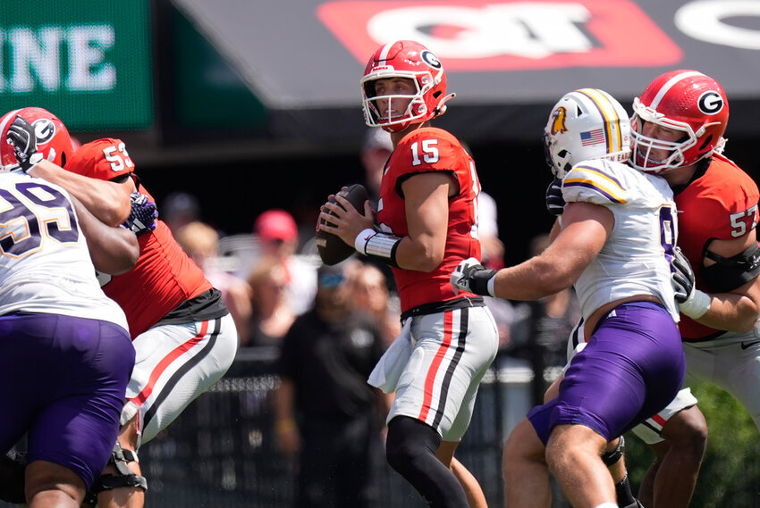 Georgia quarterback Carson Beck (15) looks for an open reciever during the first half against Tennessee Tech, Saturday, Sept. 7, 2024, in Athens, Ga. (AP Photo/John Bazemore)