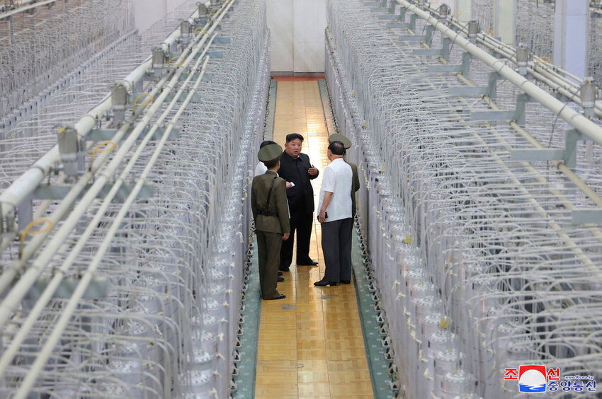 North Korean leader Kim Jong Un, center, on an inspecting visit at what is said to be an institute of nuclear weapons and a facility for nuclear materials at an undisclosed location in North Korea. (Korean Central News Agency/Korea News Service via AP)