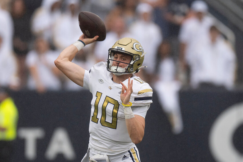 Georgia Tech quarterback Haynes King (10) throws on the run during the first half of a NCAA college football game against Virginia Military Institute Saturday, Sept. 14, 2024, in Atlanta. (AP Photo/John Bazemore)