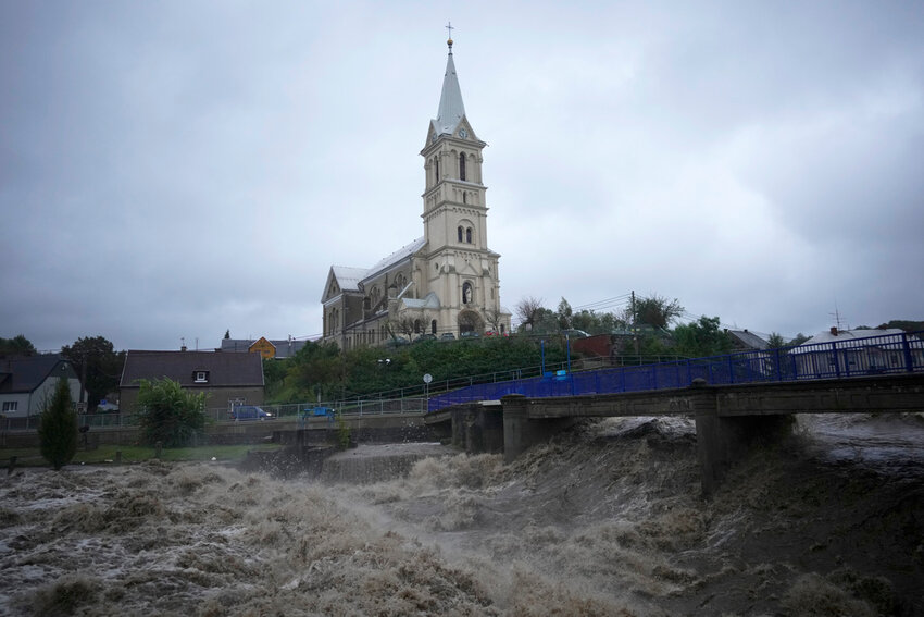 The Bela River flows past a church during floods in Mikulovice, Czech Republic, Saturday, Sept. 14, 2024. (AP Photo/Petr David Josek)