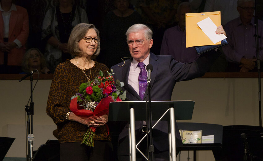 Dr. Philip May, right, and his wife, Delaine, accept gifts from the congregation during their retirement celebration on Sunday, Sept. 8, 2024, at Pleasant Valley South Baptist Church. (Photo/Pleasant Valley South Baptist Church)