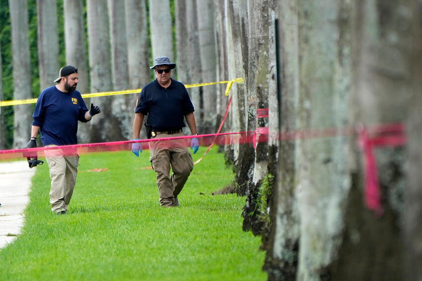 Law enforcement officials work outside of the Trump International Golf Club after an assassination attempt on Republican presidential nominee and former President Donald Trump Monday, Sept. 16, 2024, in West Palm Beach, Fla. (AP Photo/Lynne Sladky)