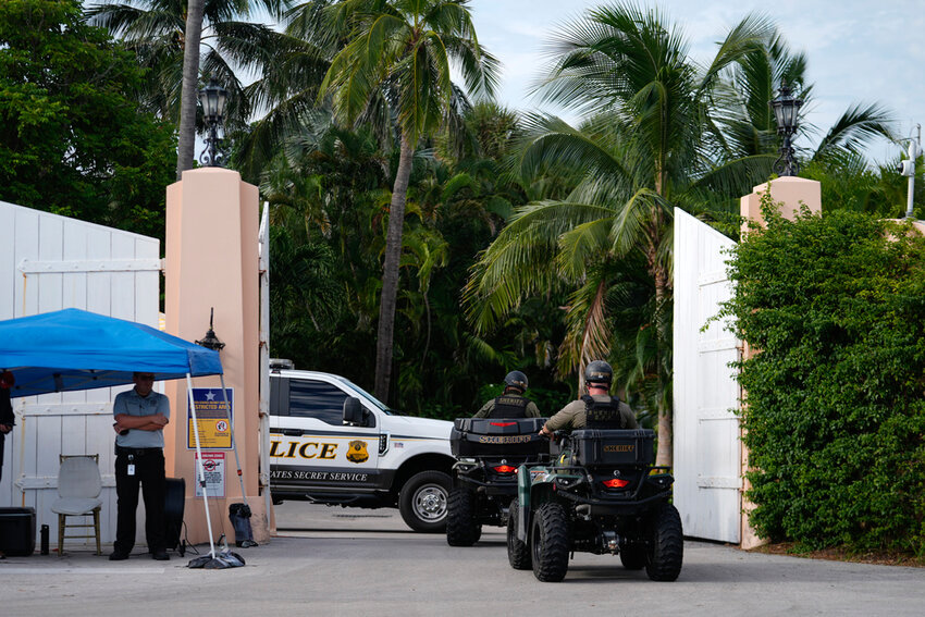 Police drive in to the Mar-a-Lago estate of Republican presidential nominee and former President Donald Trump, one day after an assassination attempt, in Palm Beach, Fla., Monday, Sept. 16, 2024. (AP Photo/Rebecca Blackwell)