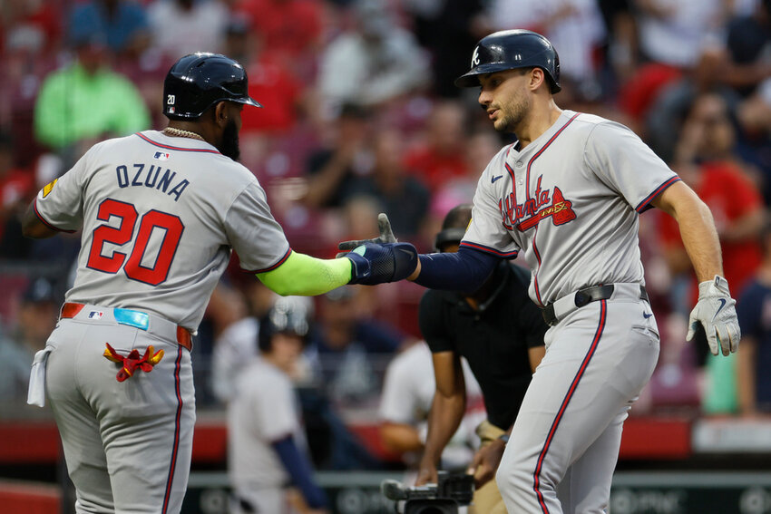 Atlanta Braves' Matt Olson, right, celebrates his home run against the Cincinnati Reds with teammate Marcell Ozuna during the first inning Tuesday, Sept. 17, 2024, in Cincinnati. (AP Photo/Jay LaPrete)