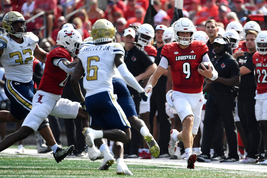 Louisville quarterback Tyler Shough (9) runs for a first down during the first half of an NCAA college football game in Louisville, Ky., Saturday, Sept. 21, 2024. (AP Photo/Timothy D. Easley)