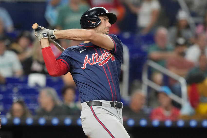 Atlanta Braves' Matt Olson hits a two-run home run during the seventh inning of a baseball game against the Miami Marlins, Saturday, Sept. 21, 2024, in Miami. (AP Photo/Marta Lavandier)