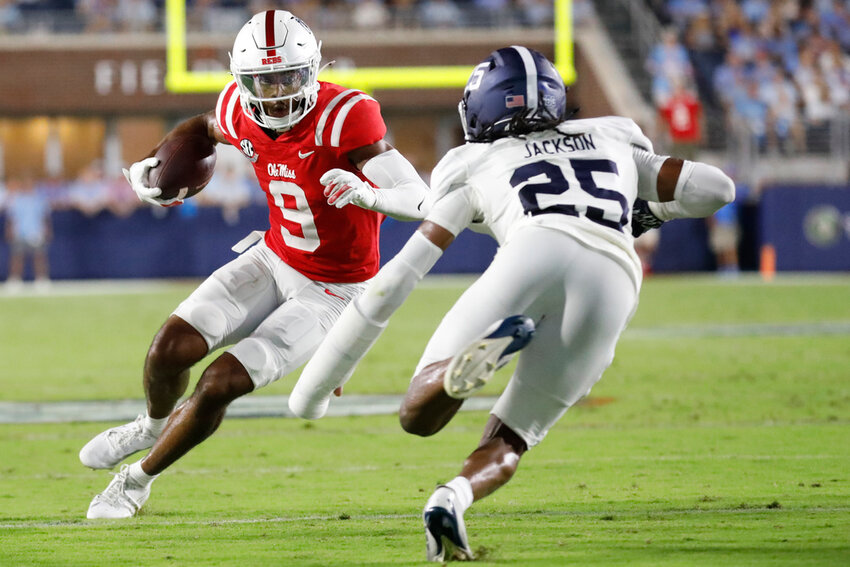 Mississippi wide receiver Tre Harris III (9) dodges Georgia Southern defensive back Ayden Jackson (25) while running the ball during the first half of an NCAA college football game, Saturday, Sept. 21, 2024, in Oxford, Miss. (AP Photo/Sarah Warnock)