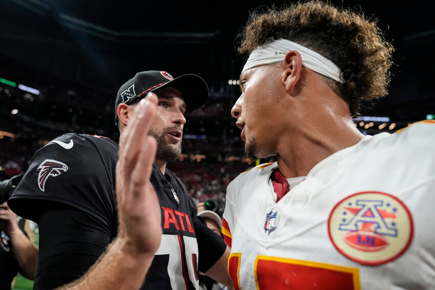 Atlanta Falcons quarterback Kirk Cousins speaks with Kansas City Chiefs quarterback Patrick Mahomes after an NFL game, Sunday, Sept. 22, 2024, in Atlanta. The Kansas City Chiefs won 22-17. (AP Photo/Brynn Anderson)