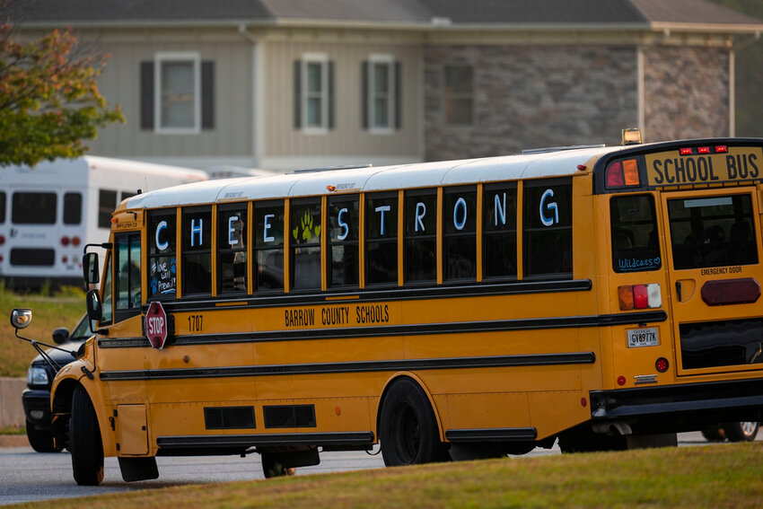 A school bus at Apalachee High School after the school reopened almost three weeks after a deadly shooting on campus, Tuesday, Sept. 24, 2024, in Winder, Ga. (AP Photo/Mike Stewart)