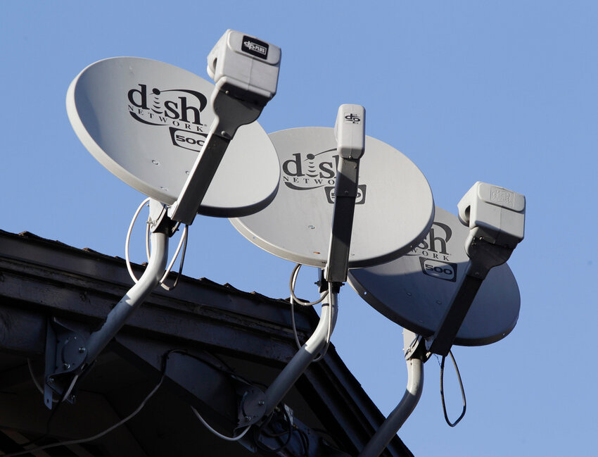 Dish Network satellite dishes are shown at an apartment complex in Palo Alto, Calif., in 2011. (AP Photo/Paul Sakuma, File)