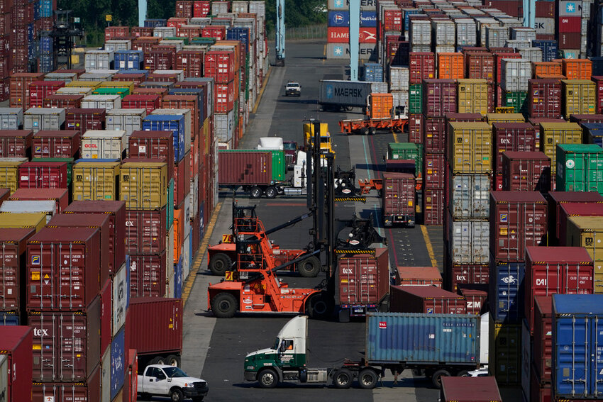 Containers are moved at the Port of New York and New Jersey in Elizabeth, N.J., on June 30, 2021. (AP Photo/Seth Wenig, File)