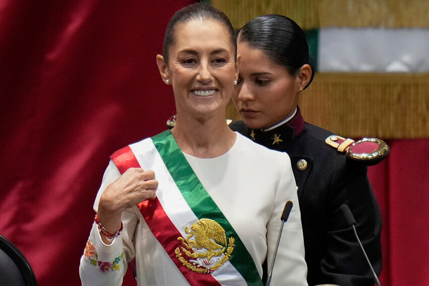 Claudia Sheinbaum wears the presidential sash during her swearing in ceremony as Mexico's new president in Mexico City, Tuesday, Oct. 1, 2024. (AP Photo/Eduardo Verdugo)