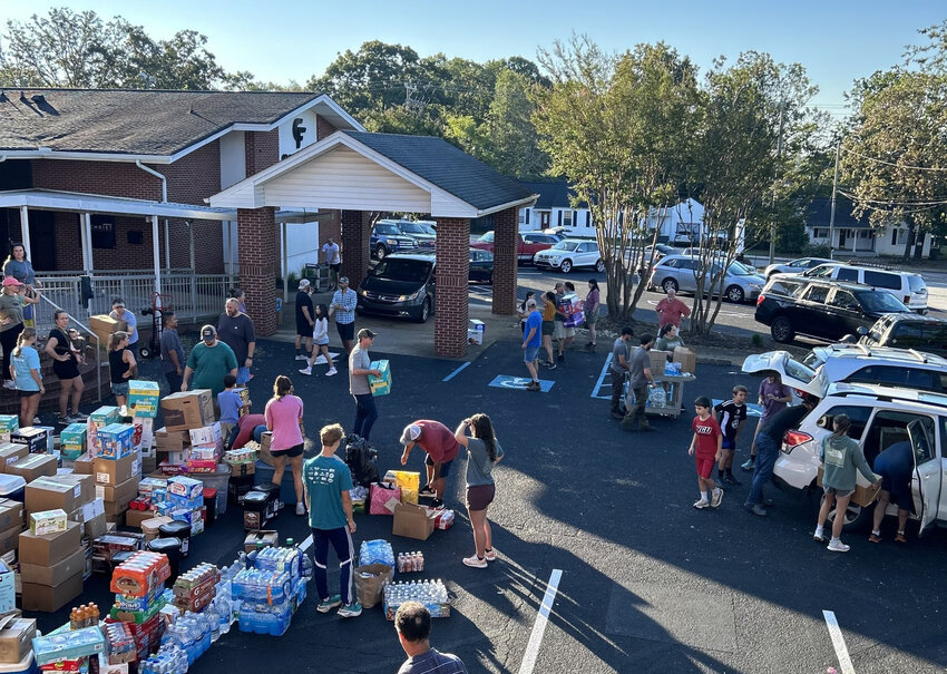 Members of Grace Baptist Church in West Asheville meet Wednesday morning and load up vehicles with donations. (Photo/Baptist Courier)