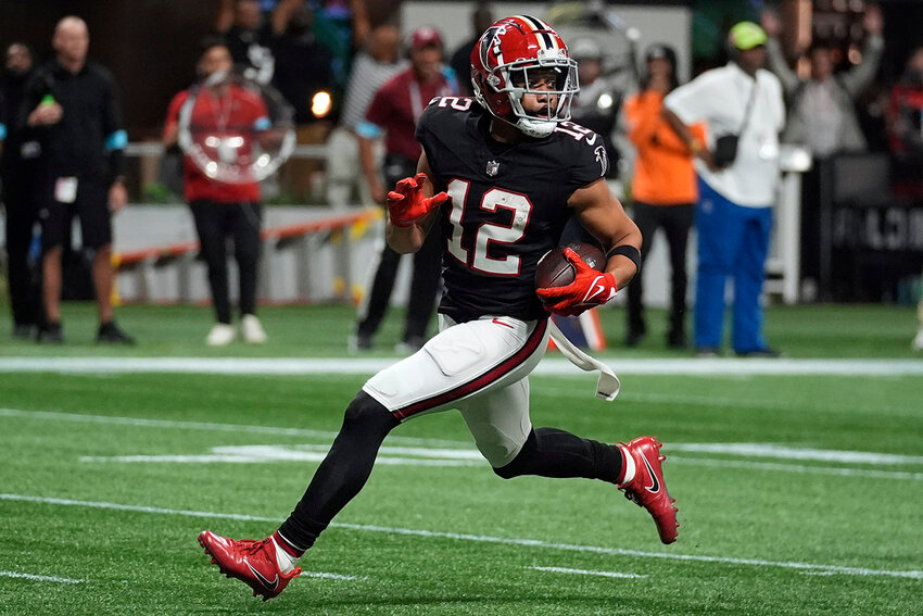 Atlanta Falcons wide receiver KhaDarel Hodge (12) scores the game-wining touchdown against the Tampa Bay Buccaneers in overtime Thursday, Oct. 3, 2024, in Atlanta. (AP Photo/John Bazemore)