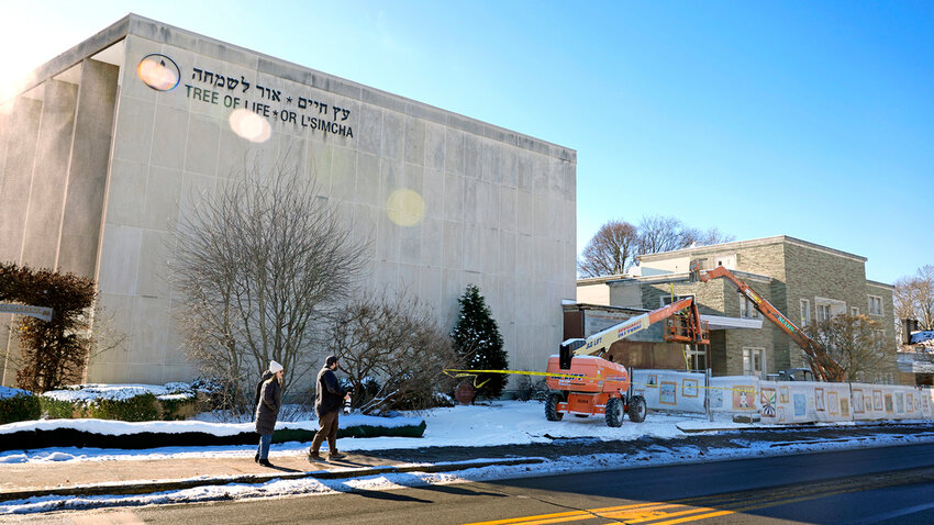 Workers begin demolition Wednesday, Jan. 17, 2023, at the Tree of Life building in Pittsburgh, the site of the deadliest antisemitic attack in U.S. history, as part of the effort to reimagine the building to honor the 11 people who were killed there in 2018. (AP Photo/Gene J. Puskar, File)