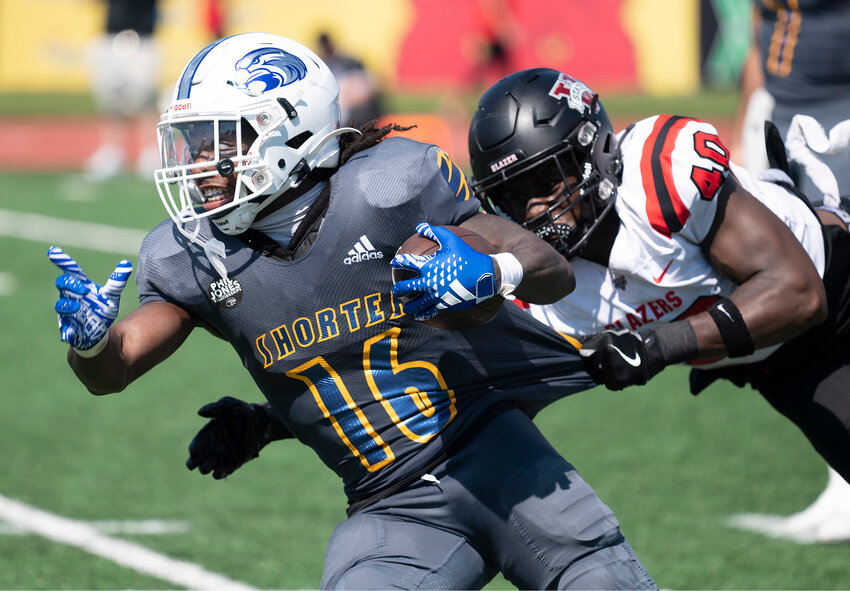 Valdosta State linebacker Joko Willis (40) drags down Shorter University running back Charles Alia for a loss in the second quarter Saturday, Oct. 5, in Rome, Ga. (Index/Henry Durand)