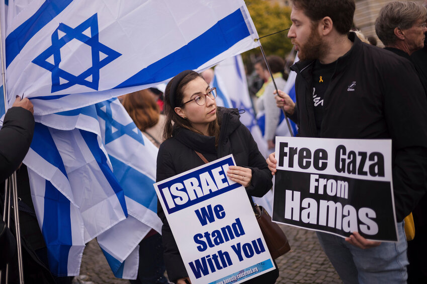 People attend a demonstration in support of Israel to mark the first anniversary of the Hamas terror attack on Israel, at the Brandenburg Gate in Berlin, Germany, Sunday, Oct. 6, 2024. (AP Photo/Markus Schreiber)