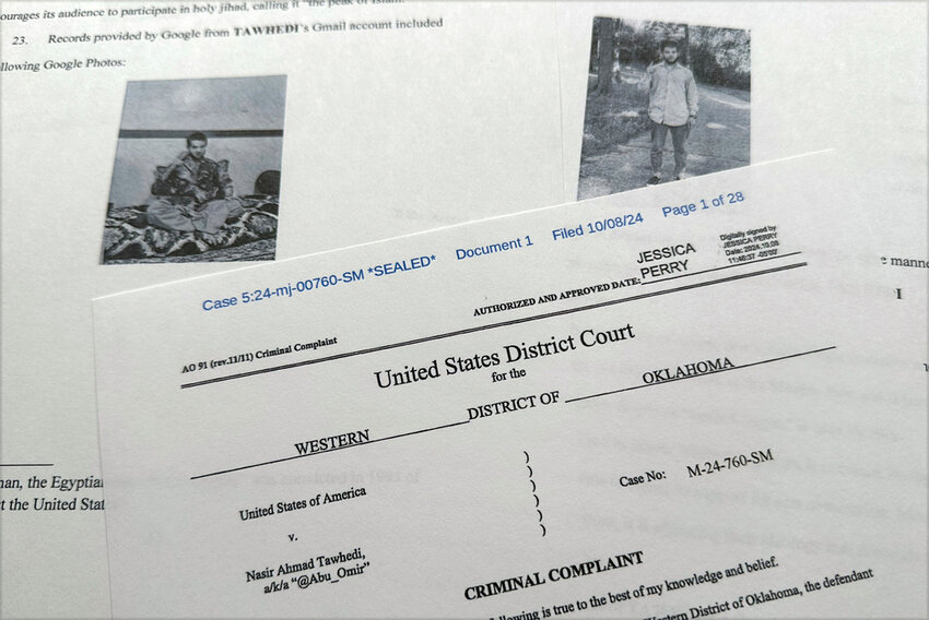 The criminal complaint, filed by the Justice Department, against Nasir Ahmad Tawhedi, 27, of Oklahoma City, Tuesday, Oct. 8, 2024. (AP Photo/Jon Elswick)