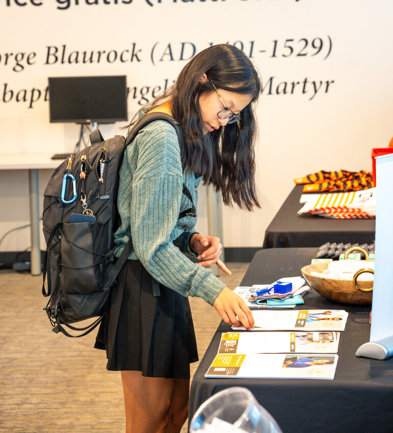 Gianna Claxton examines a table at the Nursing Job Fair. (photo courtesy of Truett McConnell University)