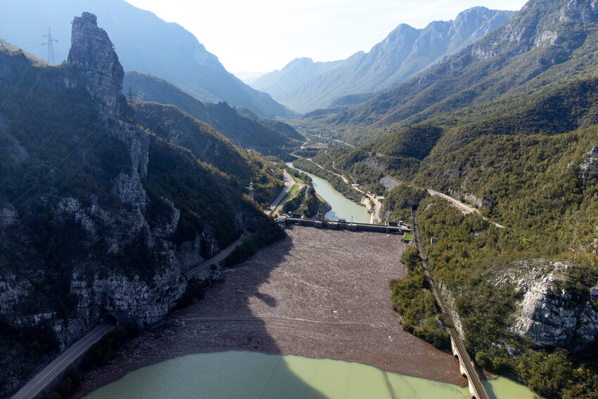 Aerial view of waste stuck at the dam on the Neretva river caused by landslides, torrential rain and flash floods in Grabovica, Bosnia, Sunday, Oct. 13, 2024. (AP Photo/Armin Durgut)