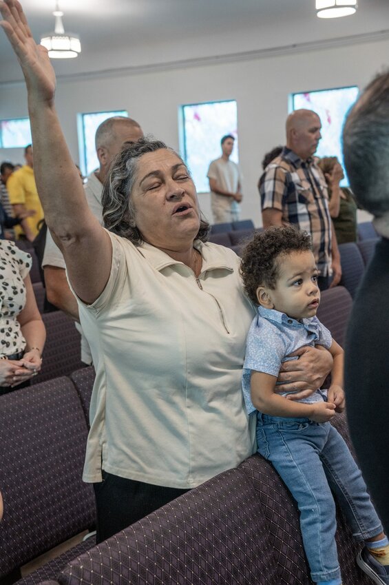 Just days after Hurricane Milton’s devastation, church members of all ages gather to “to sing of the greatness of Christ” during the Sunday morning worship service of Iglesia Bautista Bethel in Tampa. Photo by Jim Veneman