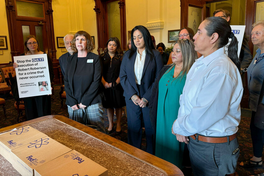 Elizabeth Ramirez, center, Casandra Rivera, center right, and Anna Vasquez, second from right, of the 