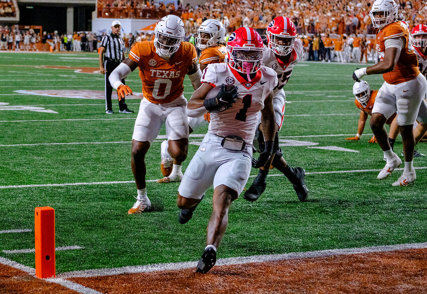 Georgia running back Trevor Etienne (1) runs into the end zone for a touchdown against Texas during the first half in Austin, Texas, Saturday, Oct. 19, 2024. (AP Photo/Rodolfo Gonzalez)