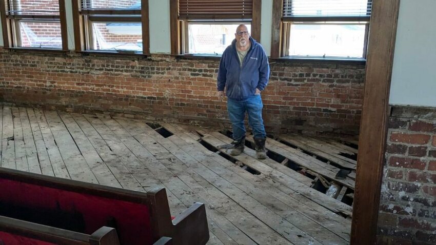 Jimmy Evans stands in the gutted sanctuary of Barnardsville Baptist Church. (Baptist Press/Robert English)