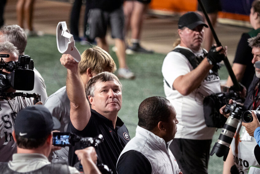 Georgia head coach Kirby Smart tips his cap to the Georgia fans in attendance after defeating Texas, Saturday, Oct. 19, 2024, in Austin, Texas. Georgia won 30-15. (AP Photo/Michael Thomas)