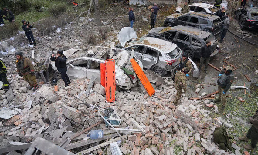 Emergency workers clear the rubble after Russia attacked the city with guided bombs overnight in Zaporizhzhia, Ukraine, Monday, Oct. 21, 2024. (Ukrainian Emergency Service via AP)