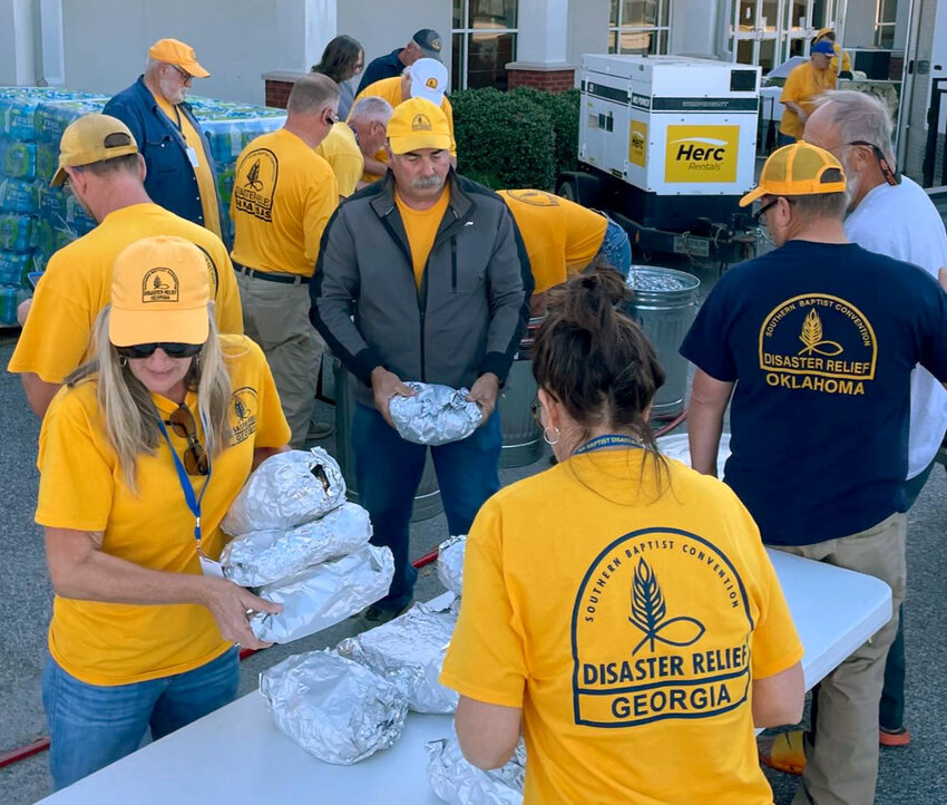 Disaster Relief volunteers from Georgia and Oklahoma prepare Boston butts to be delivered to storm victims in Vidalia, Ga., Thursday, Oct. 17, 2024. (Photo/Bob Sprinkel, GBDR)