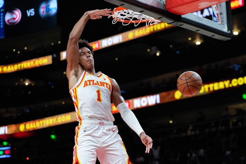 Atlanta Hawks forward Jalen Johnson scores in the first half of a preseason game against the Philadelphia 76ers, Monday, Oct. 14, 2024, in Atlanta. (AP Photo/John Bazemore)