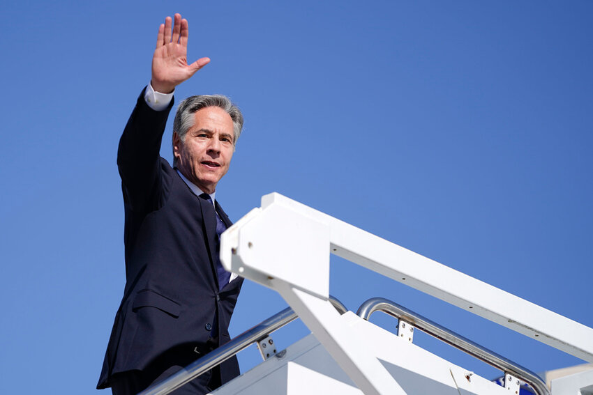 Secretary of State Antony Blinken boards a plane en route to the Middle East at Joint Base Andrews, Md., Monday, Oct. 21, 2024. (Nathan Howard/Pool Photo via AP)