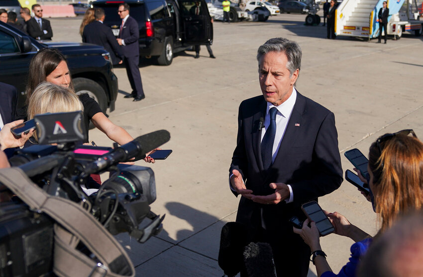 U.S. Secretary of State Antony Blinken speaks with members of the media at Ben Gurion International Airport before departing for Riyadh, Saudi Arabia, in Tel Aviv, Israel  Wednesday, Oct. 23, 2024. (Nathan Howard/Pool Photo via AP)