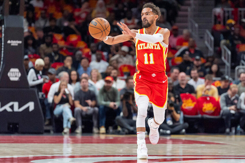 Atlanta Hawks guard Trae Young passes the ball during the first half against the Brooklyn Nets, Wednesday, Oct. 23, 2024, in Atlanta. (AP Photo/Jason Allen)